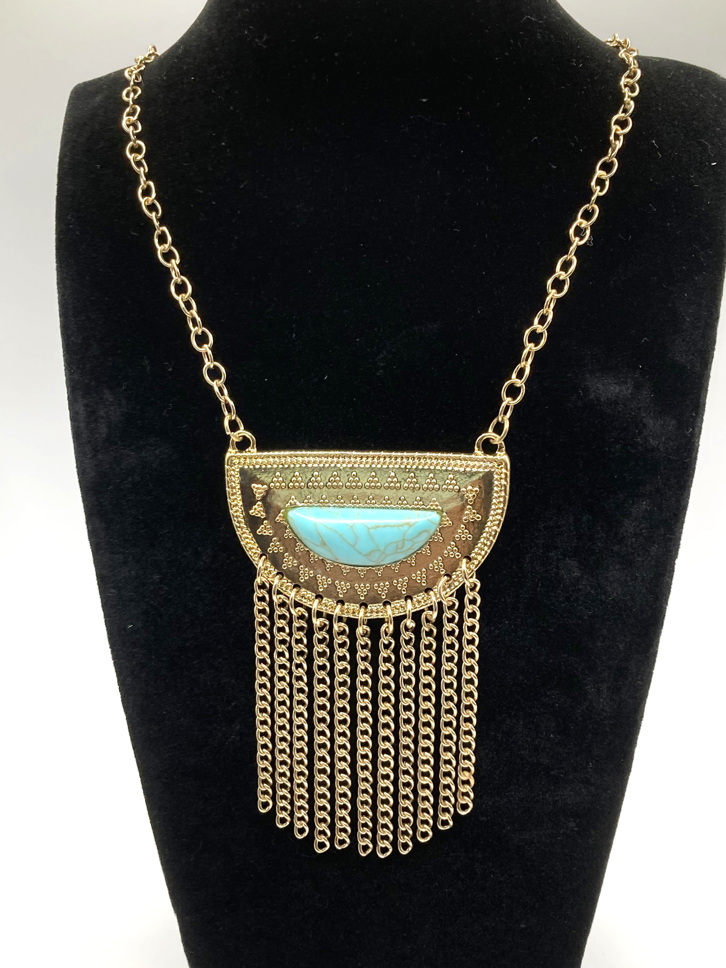 Image of brand name gold tone necklace